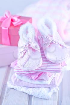 baby clothes for baby girl on a table
