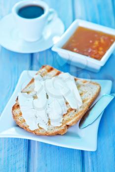 toasts with butter and sweet jam on plate