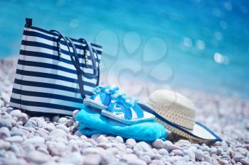 bag and hat on the beach, summer background