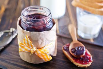jam in glass jar and on a table