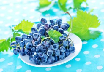 fresh grape on plate and on a table