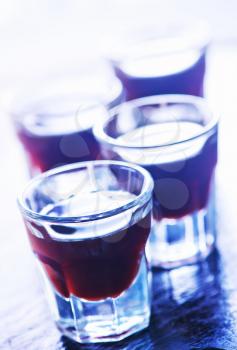 coffee liquor into small glasses and on a table
