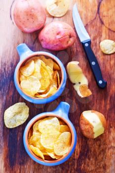 potato chips in bowls and on a table