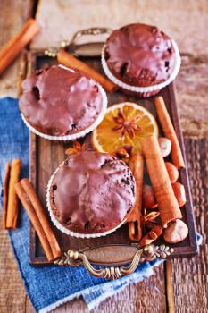 chocolate maffins and spice on the wooden table