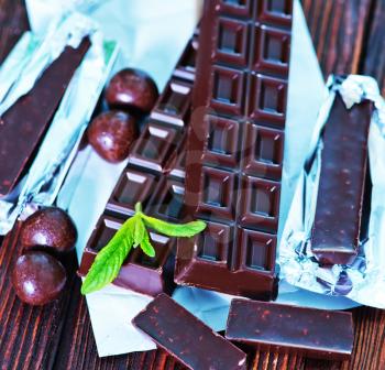 chocolate and mint leaf on the wooden table