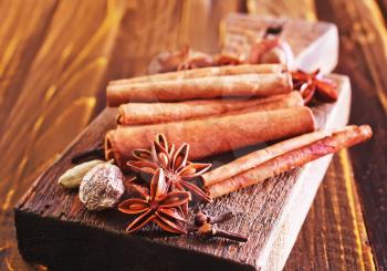 aroma spices, cinnamon an anise on wooden table