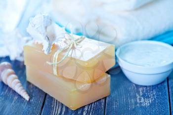 Soap and Body Lotion on the Wooden Background