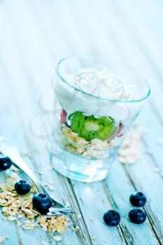 helthy breakfast, oat flakes with cream and fruit