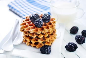 waffles on plate and on a table