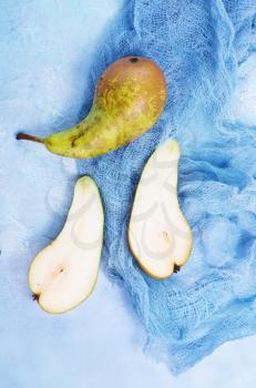 fresh pears, pears on board and on a table