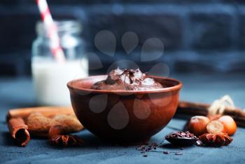 cocoa sauce in bowl and on a table