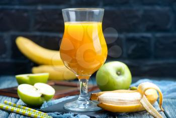 juice in glass  from fresh banana and apples