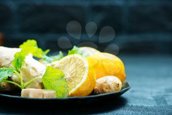 ginger with lemon and mint on a table