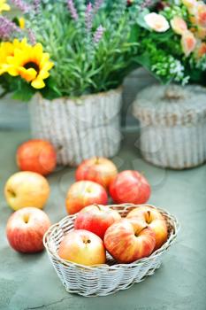 apples in basket and on a table