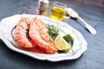 boiled shrimps on plate, shrimps with salt and lemon