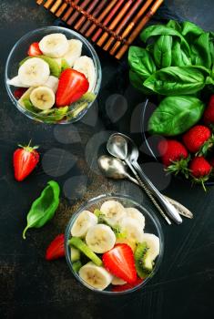 desert with fresh fruits, fruit salad, banana with strawberry