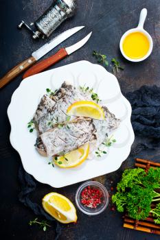raw fish fillet with spice and lemon
