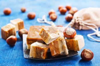 sweet nougat with nuts on blue tableware
