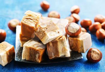 sweet nougat with nuts on blue tableware