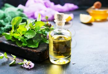 herbal oil in bottle and on a table