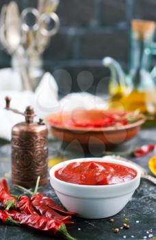 chilli sauce with spice on a table