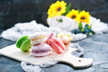color macaroons on board and on a table