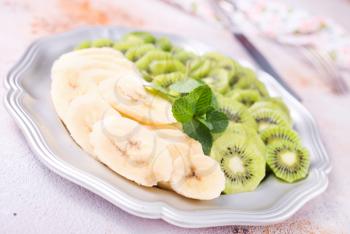 kiwi and banana on plate, fresh fruits