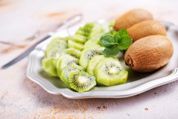 fresh kiwi on plate, fresh fruits on plate