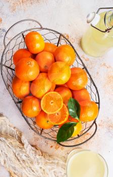 Fresh tangerines and tangerine juice. Healthy food. Stock photo