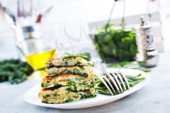 omelette with spinach leaves, diet food, omelette on plate