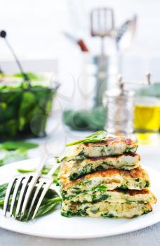 omelette with spinach leaves, diet food, omelette on plate