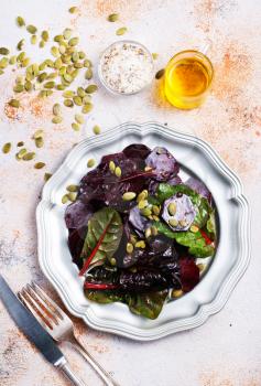 beet salad with nuts on metal plate