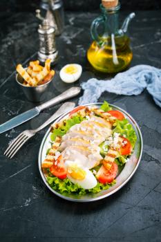 salad with baked chicken fillet, salad on plate