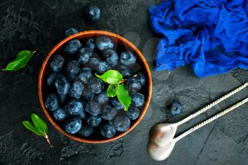 fresh blueberry in bowl and on a table