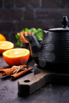  tea with cinnamon and fresh fruit in teapot