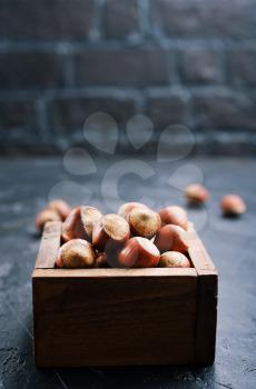 huzelnuts in wooden box on a table