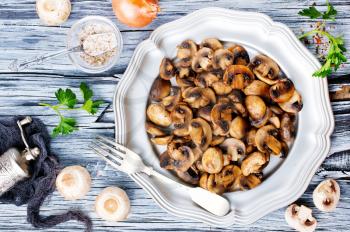 fried mushrooms, mushrooms with onion on plate