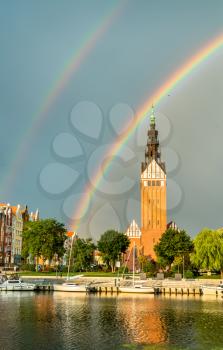 St. Nicholas Cathedral with a double rainbow in Elblag, Poland