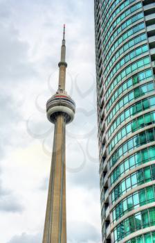 Toronto, Canada - May 2, 2017: CN Tower and another skyscraper in downtown of Toronto. The CN Tower is a 553.3 m-high concrete communications and observation tower