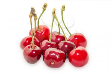 Several ripe cherries isolated on white background