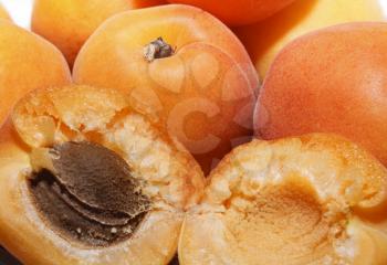 Several ripe large juicy apricots close up