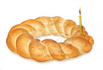 Wicker bread and burning candle isolated on white background