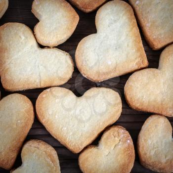 Close-up of heart shaped cookies. Cookie hearts background. Top view.