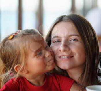 Happy family. Close-up portrait of a mother and her little daughter. Selective focus.