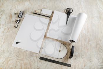 Photo. Blank stationery set on light wooden background. Template for design presentations and portfolios.