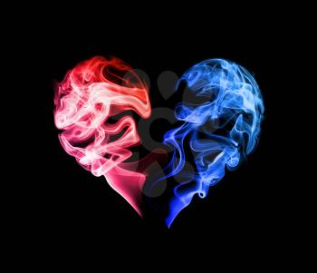 Abstract red and blue heart of the smoke on a dark background.