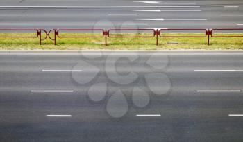 Asphalt road with white stripes. Highway with road markings.