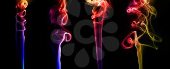 Set of abstract bright colored smoke on a dark background