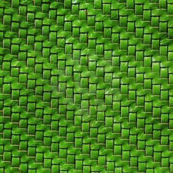 Braided leather texture. Green leather background. Front view.