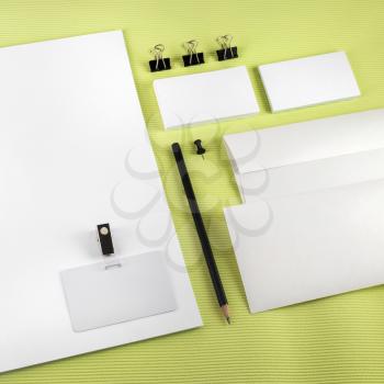 Blank corporate identity set on green background. Template for branding identity. Top view.